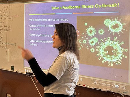 One epidemiologist in front of classroom presenting