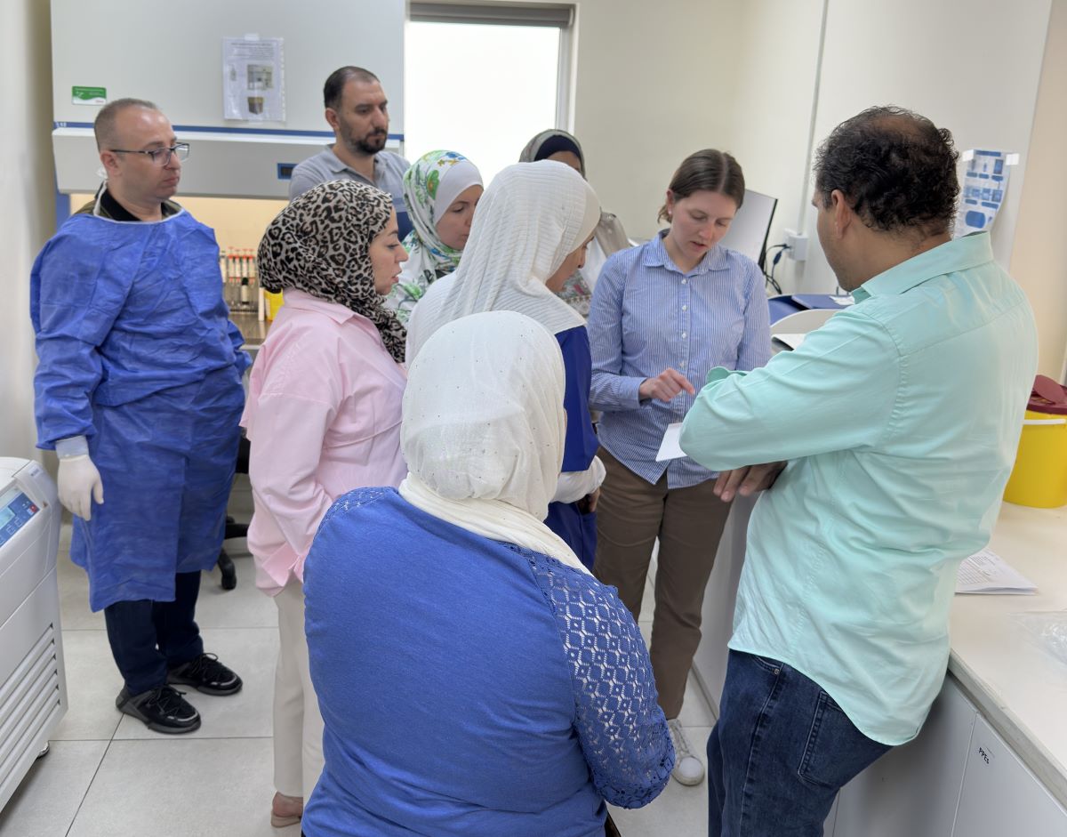 Minnesota Public Health Laboratory Scientist Laura Bohnker-Voels consulting with Jordanian colleagues