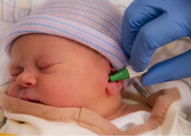 baby undergoing hearing screening