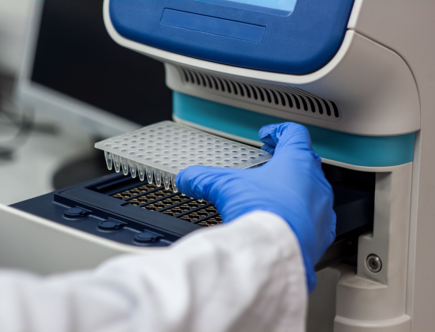 technician using PCR machine