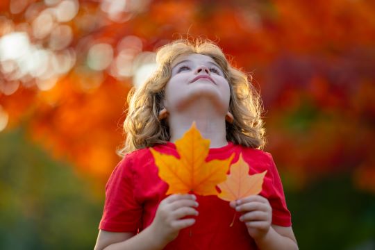 child looking at sky