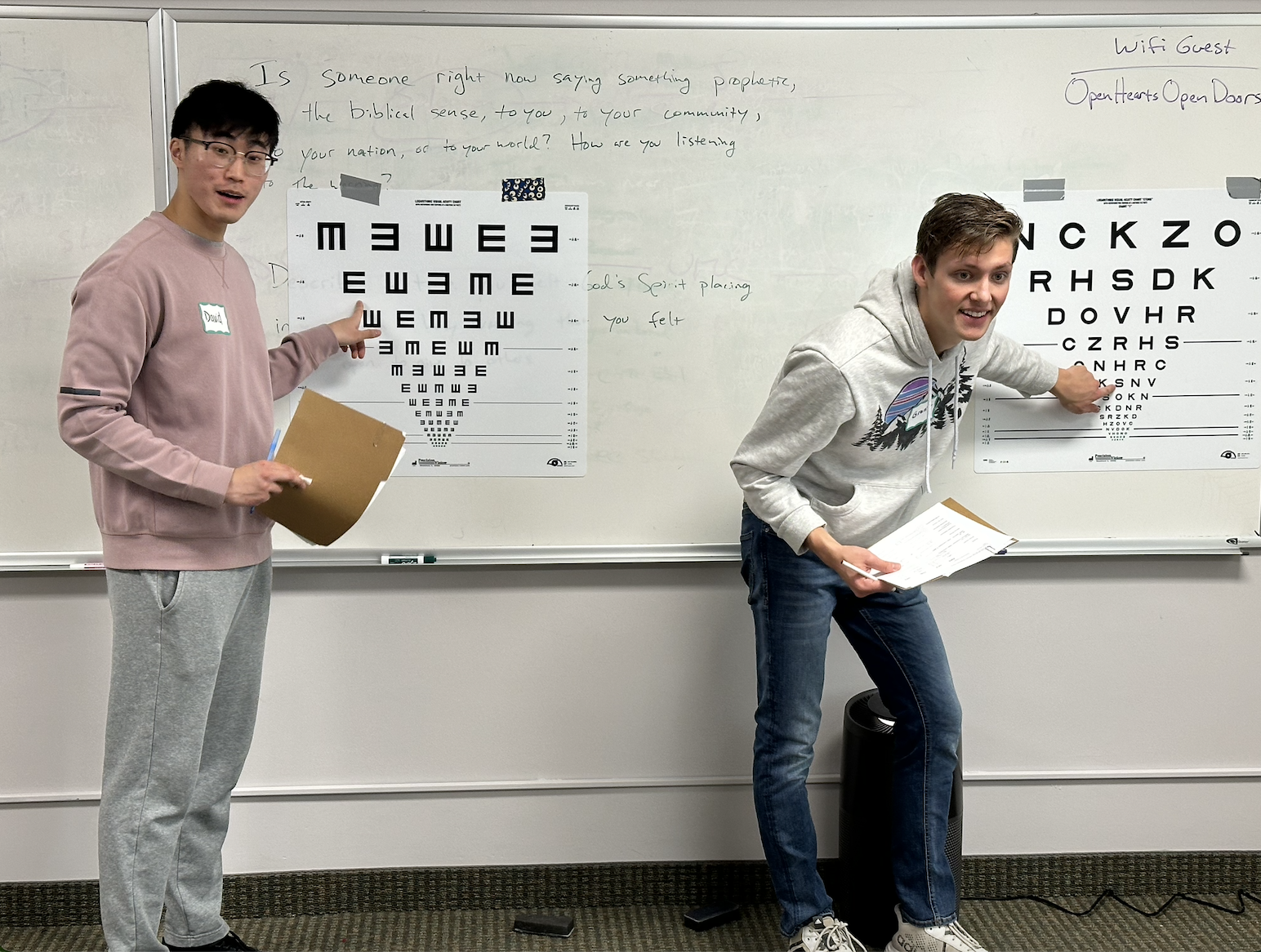 Medical students involved in ZVMS Street Medicine perform eye exams for clients.