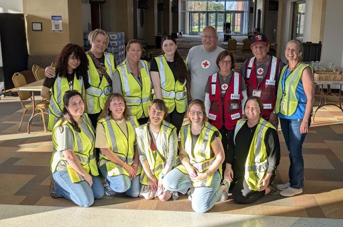 Beltrami County staff shift emergency supplies around the Sanford Center on Monday, June 23 to make way for damage repair… and a wedding.