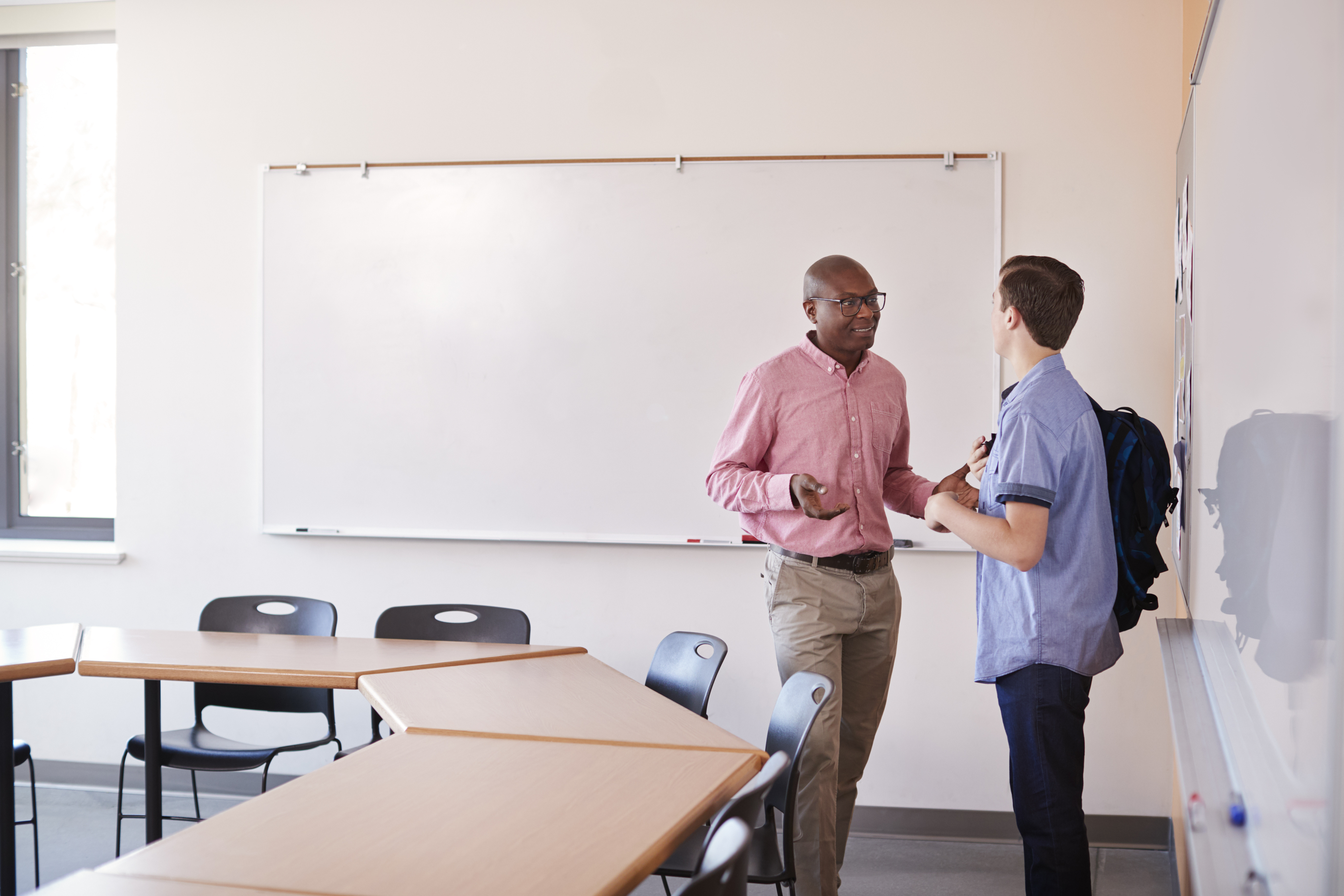 Teacher talking to student