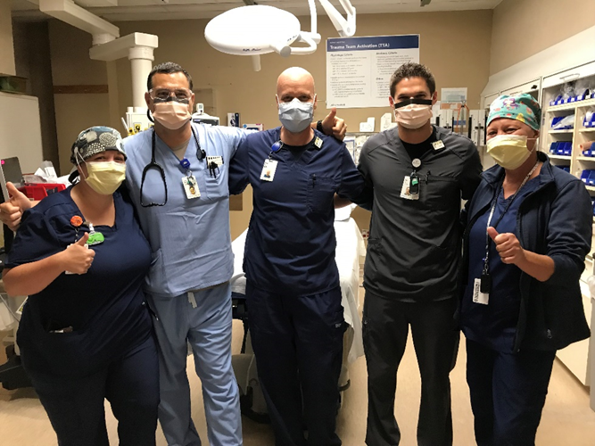 healthcare workers standing inside a hospital with masks on