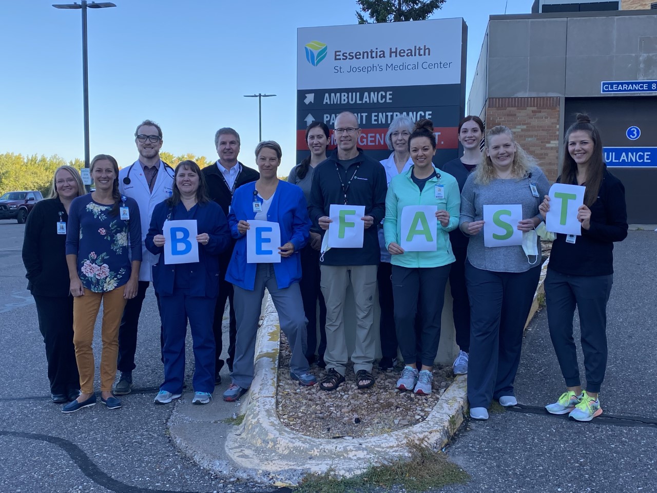 healthcare workers holding a BE FAST sign